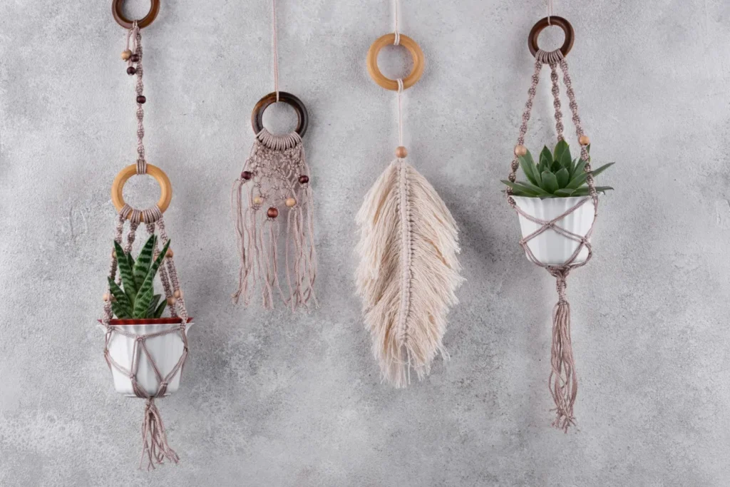 Macramé plant hangers on a wall, adding boho charm with greenery in a cozy living room.