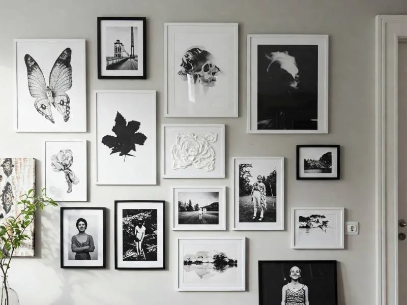 Gallery wall integrated into home decor with a mix of framed art, mirrors, and wall shelves